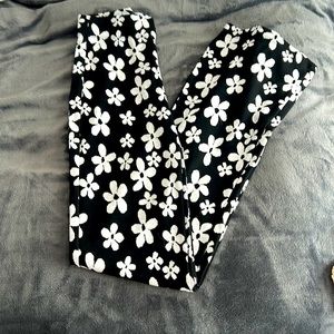 Urban Outfitters black flare leggings with white flowers
